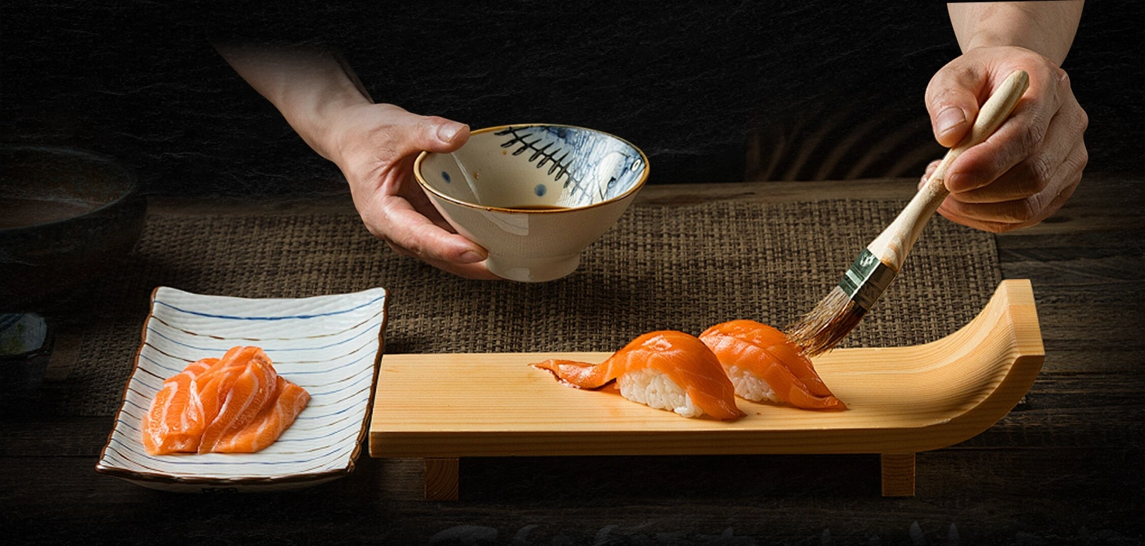 Nigiri being brushed with tare